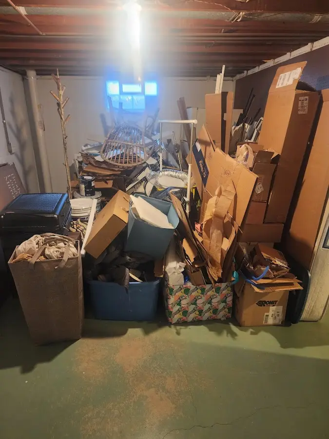 Roll-off dumpster container at job site for 2 Yard Dumpster Rental in Riley